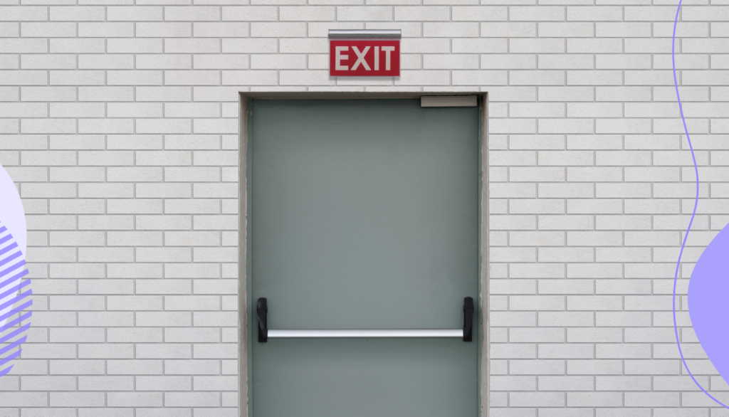 A gray door with a red exit sign over it.